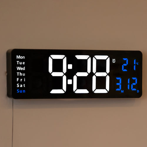 Opis Clock 1: Die digitale Wanduhr mit leuchtenden Ziffern